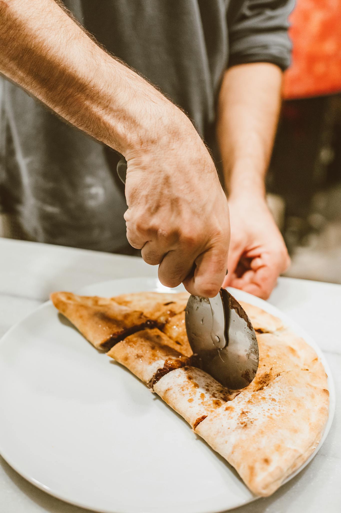 Close Up Of A Hand Cutting A Freshly
