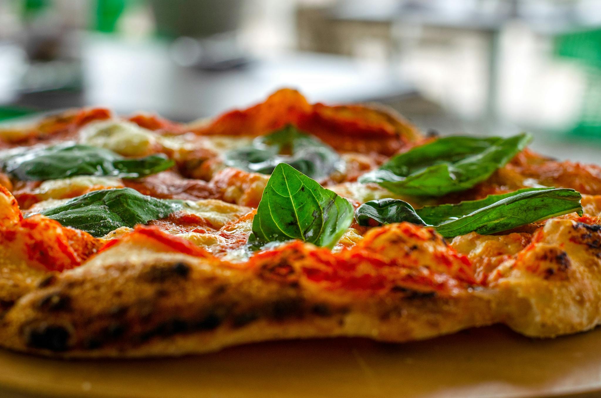 Close Up Shot Of Fresh Basil Leaves Topping