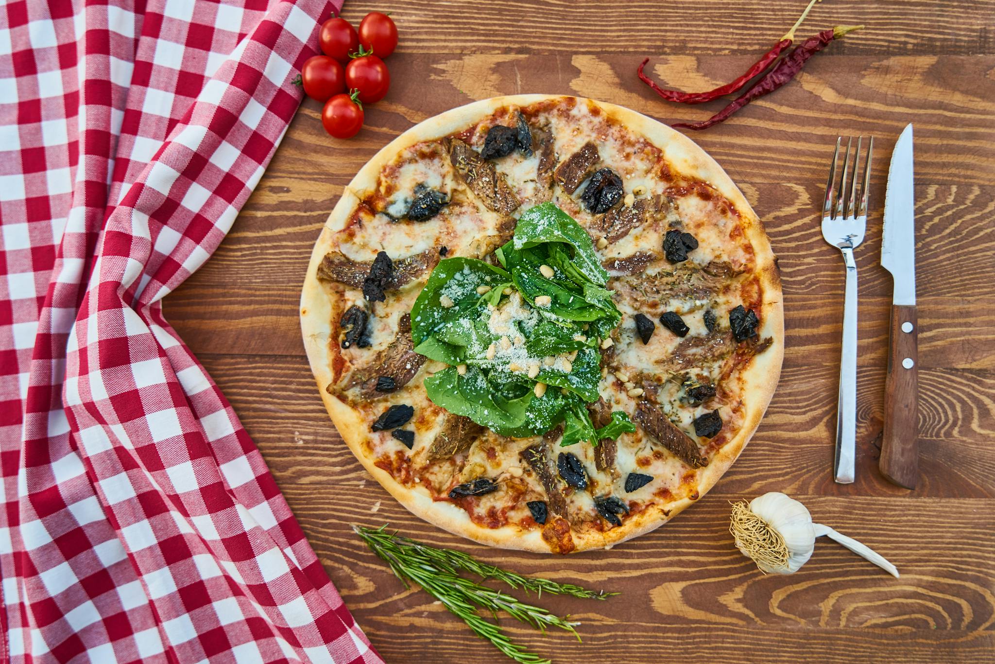 Delicious Italian Pizza Topped With Greens And